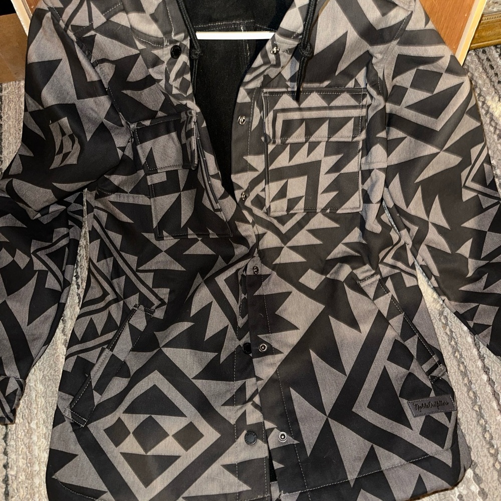 Black and Gray Ski Jackets with Geometric Design